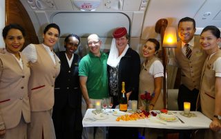 A surprise anniversary party at 40,000 feet! Karen got to wear Emirates' signature uniform hat. Maybe I should have too, to cut the glare.