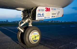 WheelTug wheel-hub electric motor installed on the nose gear of the 737-700 test aircraft. Cool hubcaps. Courtesy: WheelTug