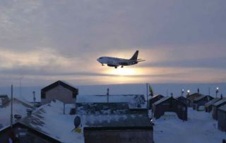 A Nolinor Boeing 737-200C, landing in the twilight at a remote Northern exploration site. Photo: Nolinor