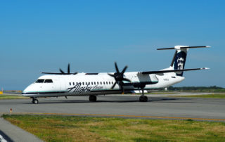 An Alaska Airlines Q400 - now De Havilland Canada DHC-8-400 - taxies in at YVR.